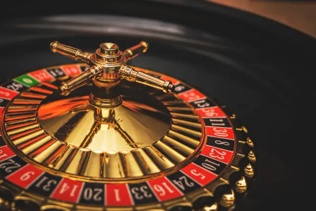Close-up of a gold and red roulette wheel